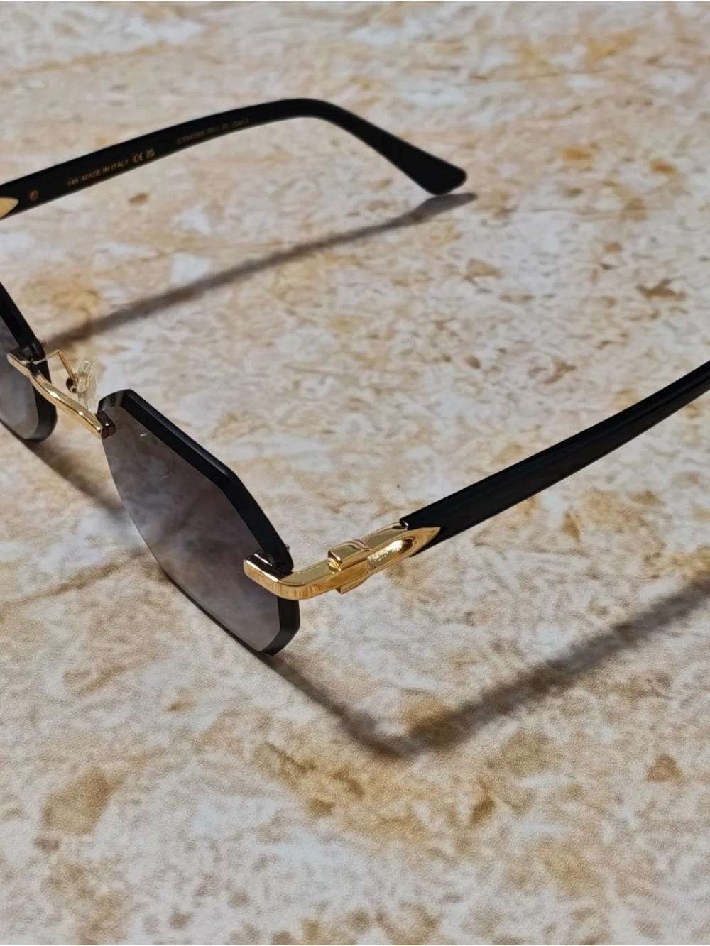 Cartier Women’s Rimless Sunglasses with Purple Gradient Lenses and Gold Accents